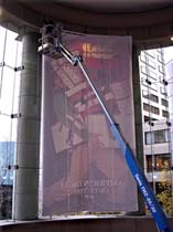 60’ bucket used to install banner inside department store in Seattle, WA