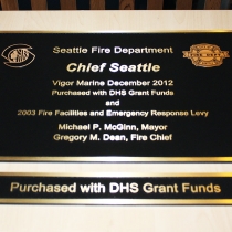 Cast brass plaque, textured background and brushed finish in Seattle Washington