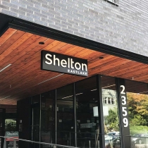 Cabinet sign with dimensional letters for Shelton apartments in Seattle, Washington