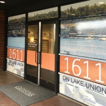 One way film / perforated window film graphics for 1611 On Lake Union apartments in Seattle, Washington.