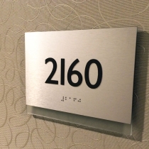 Unit number / ADA sign for apartment.