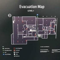 12-Evacuation-map-sign-on-1-8”-thick-non-glare-acrylic,-back-painted-dark-green-with-digital-print-graphics