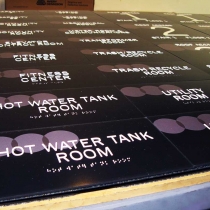 17-Various-room-identifier-signs-on-1-8”-thick-non-glare-acrylic,-raised-text,-digital-print-back-and-clear-braille-bead