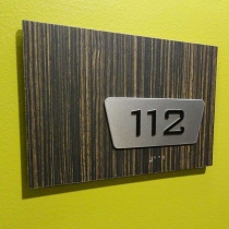 3--¼”-thick-backer-board-with-custom-wood-grain-laminate,-aluminum-backer-for-raised-text-and-clear-braille-bead
