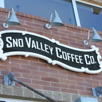 Sandblasted sign mounted to brick wall in Snoqualmie Washington