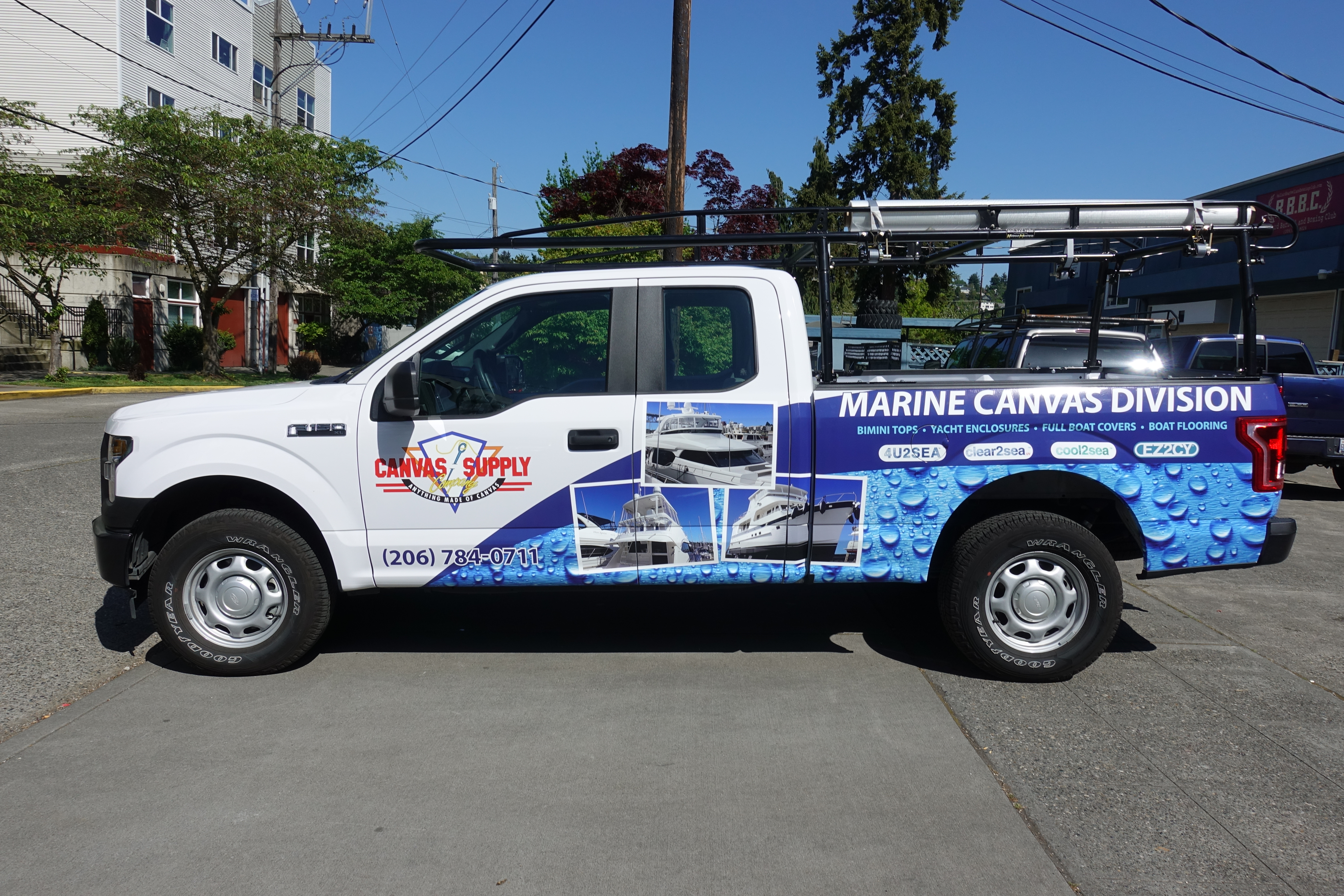 Side View of White Truck with Digitally Printed Vehicle Graphics Advertizing Canvas Supply Awnings