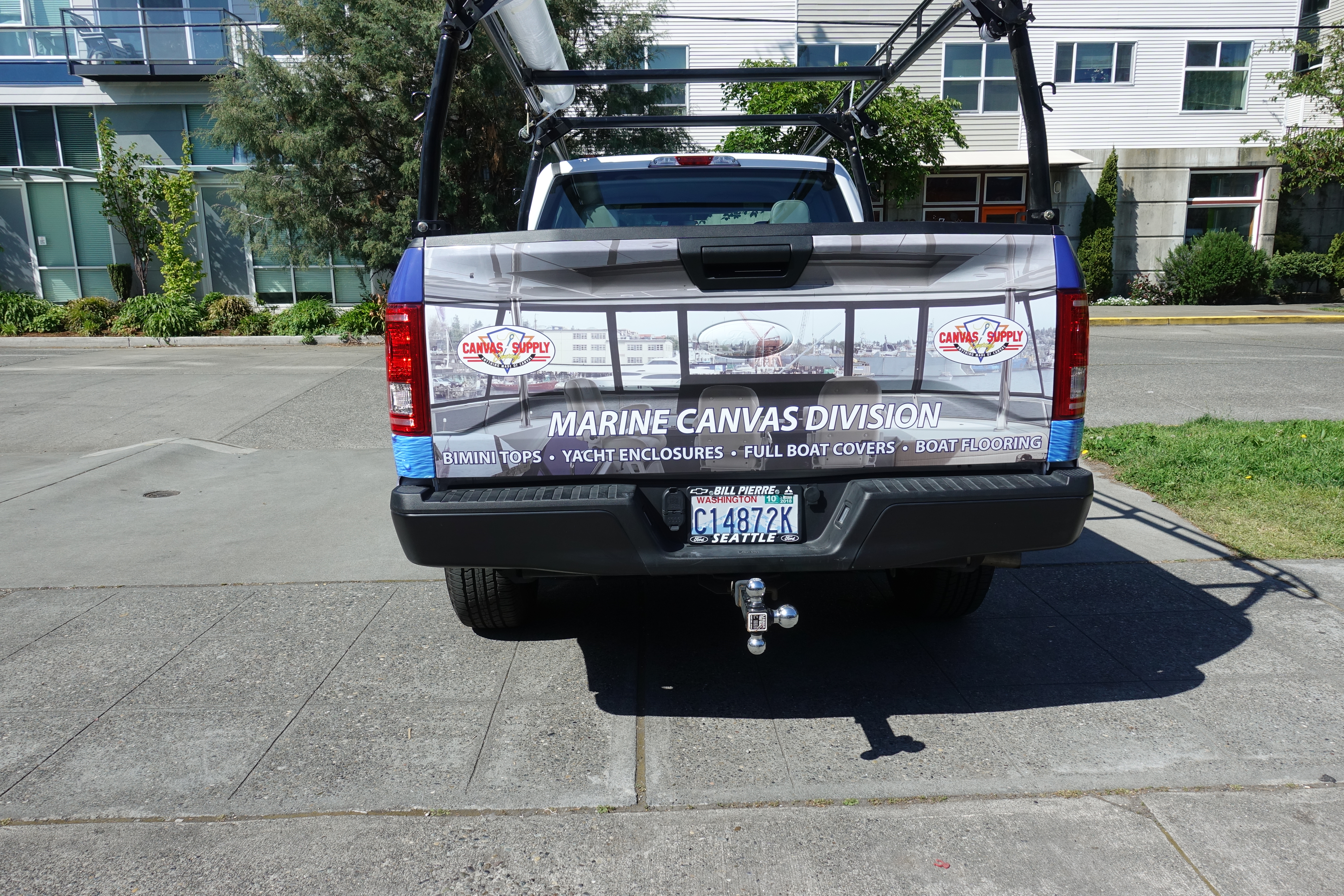 Back View of White Truck with Digitally Printed Vehicle Graphics Advertizing Canvas Supply Awnings