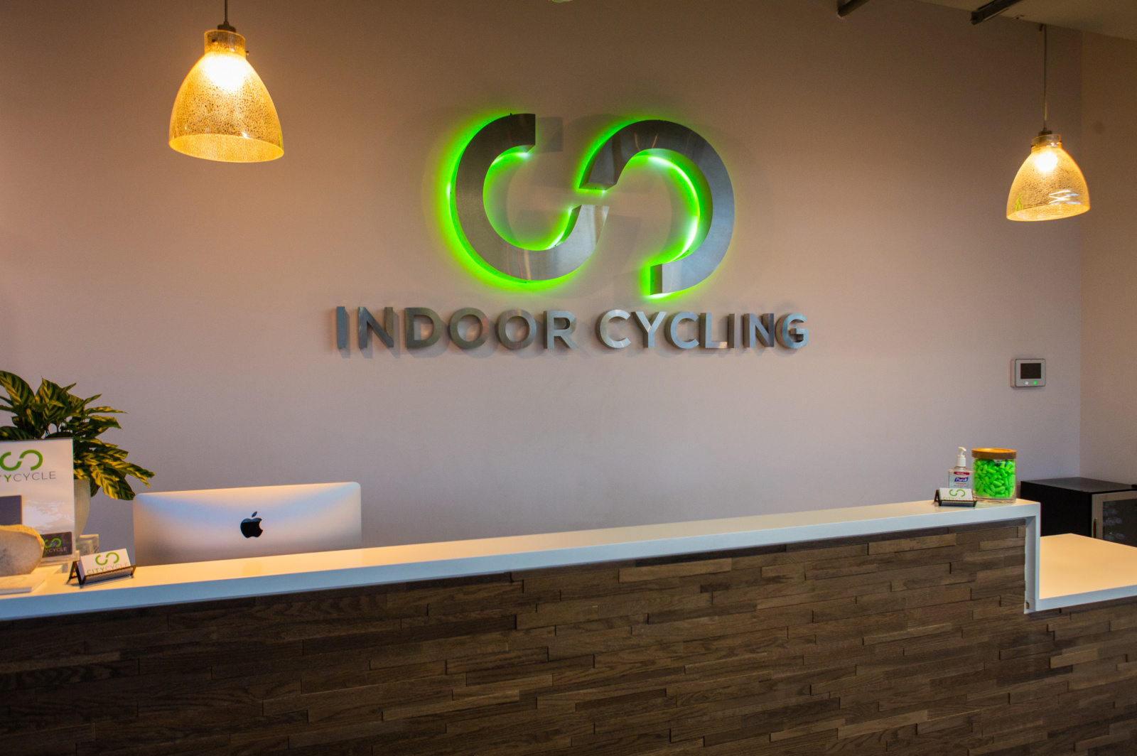 Illuminated Raised Logo Behind Reception Desk